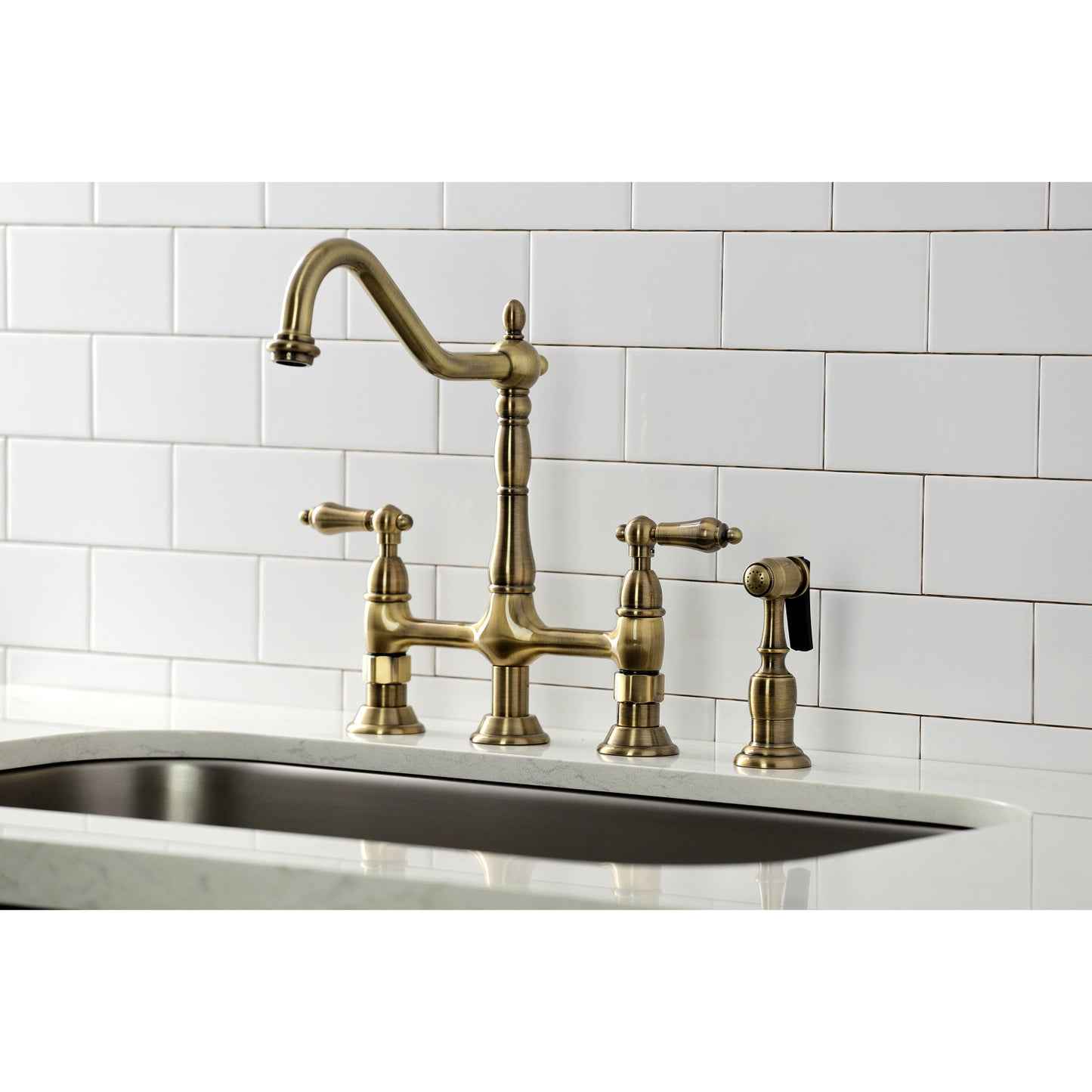 KINGSTON Brass Heritage Bridge Kitchen Faucet with Brass Sprayer top view showing elegant bridge design and sprayer.