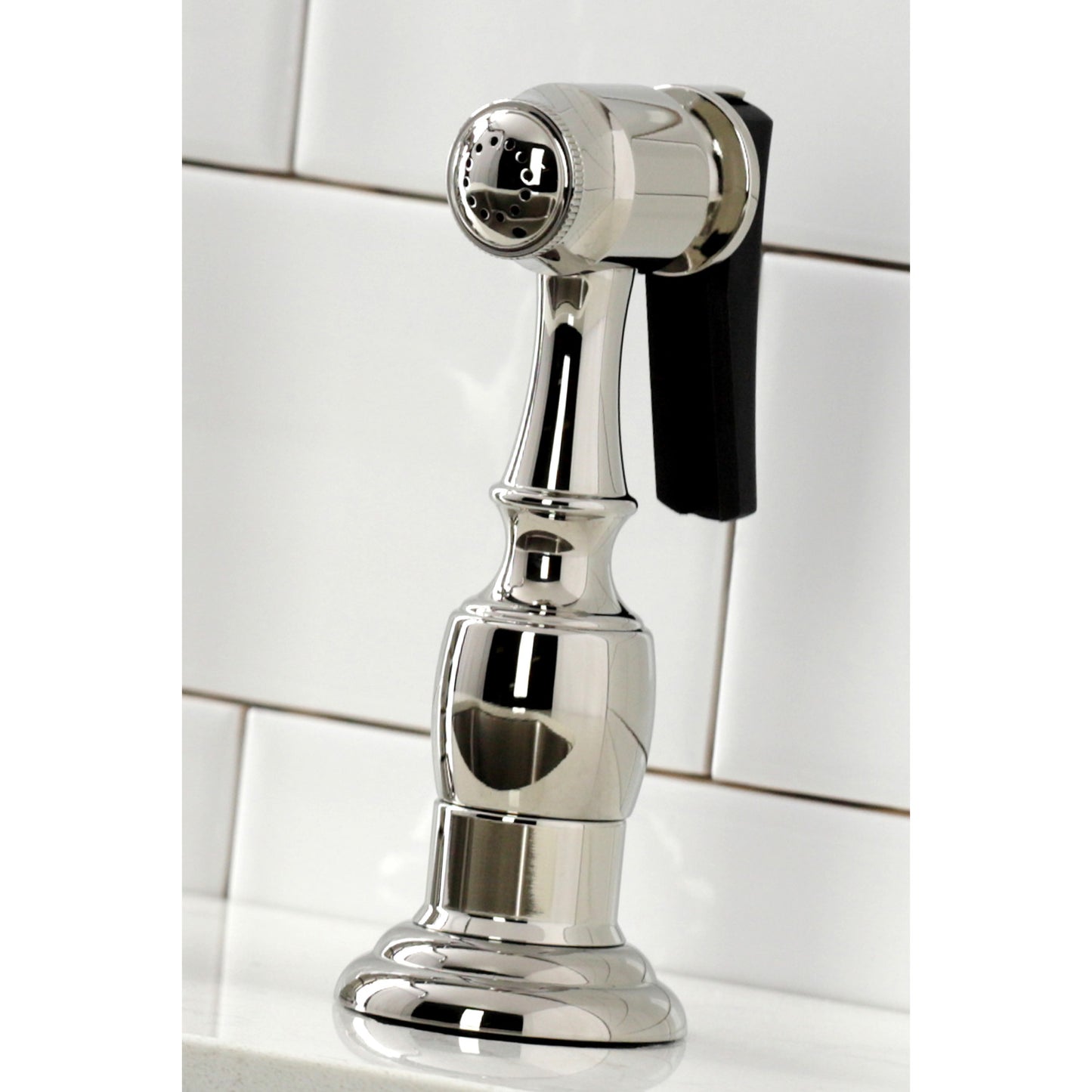 KINGSTON Brass Heritage Bridge Kitchen Faucet with Brass Sprayer left side view of brass sprayer attachment
