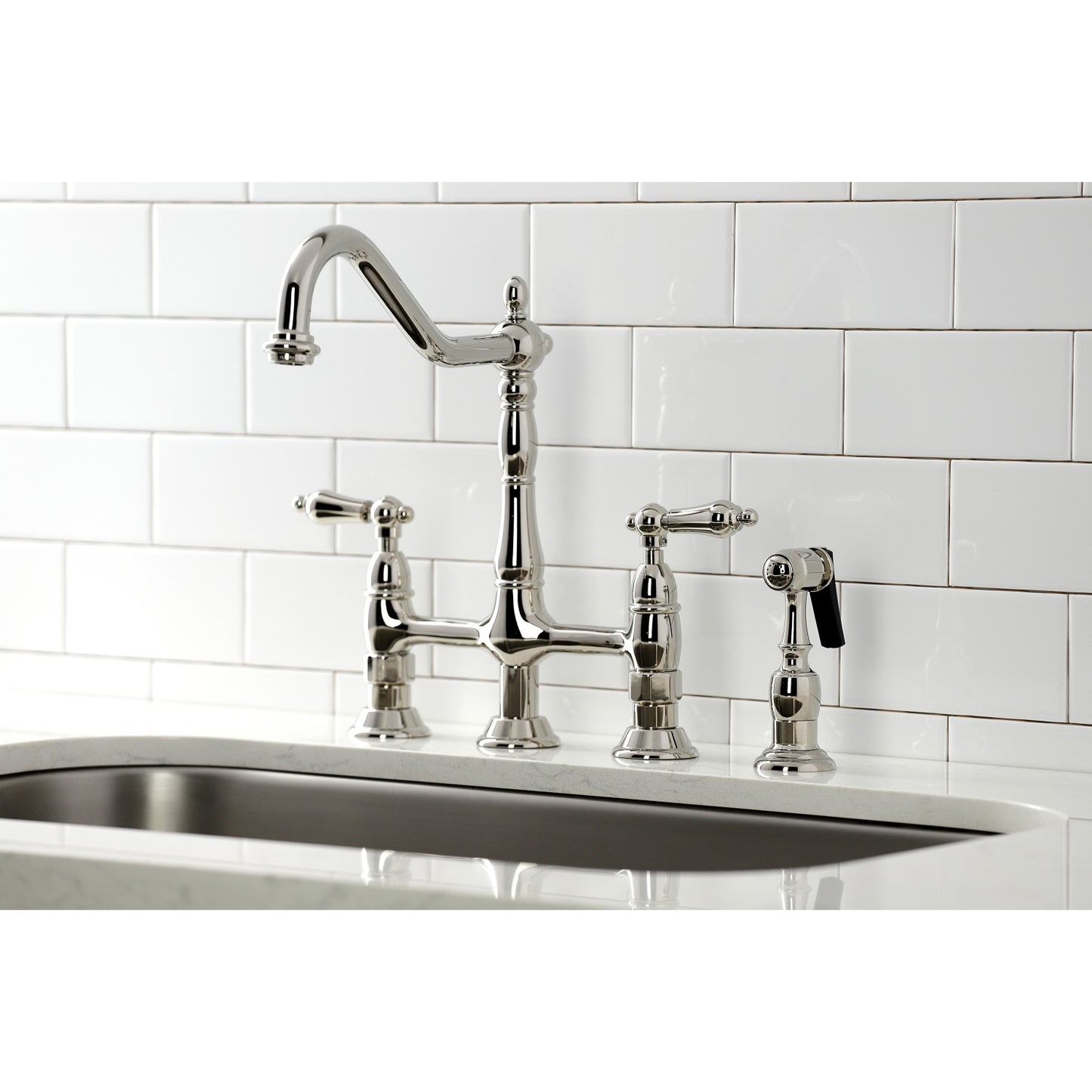 Kingston Brass KS1276ALBS polished nickel kitchen faucet and sink against a white tiled wall