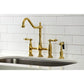 Kingston Brass KS1277ALBS brushed brass kitchen faucet with white tiled wall in the background