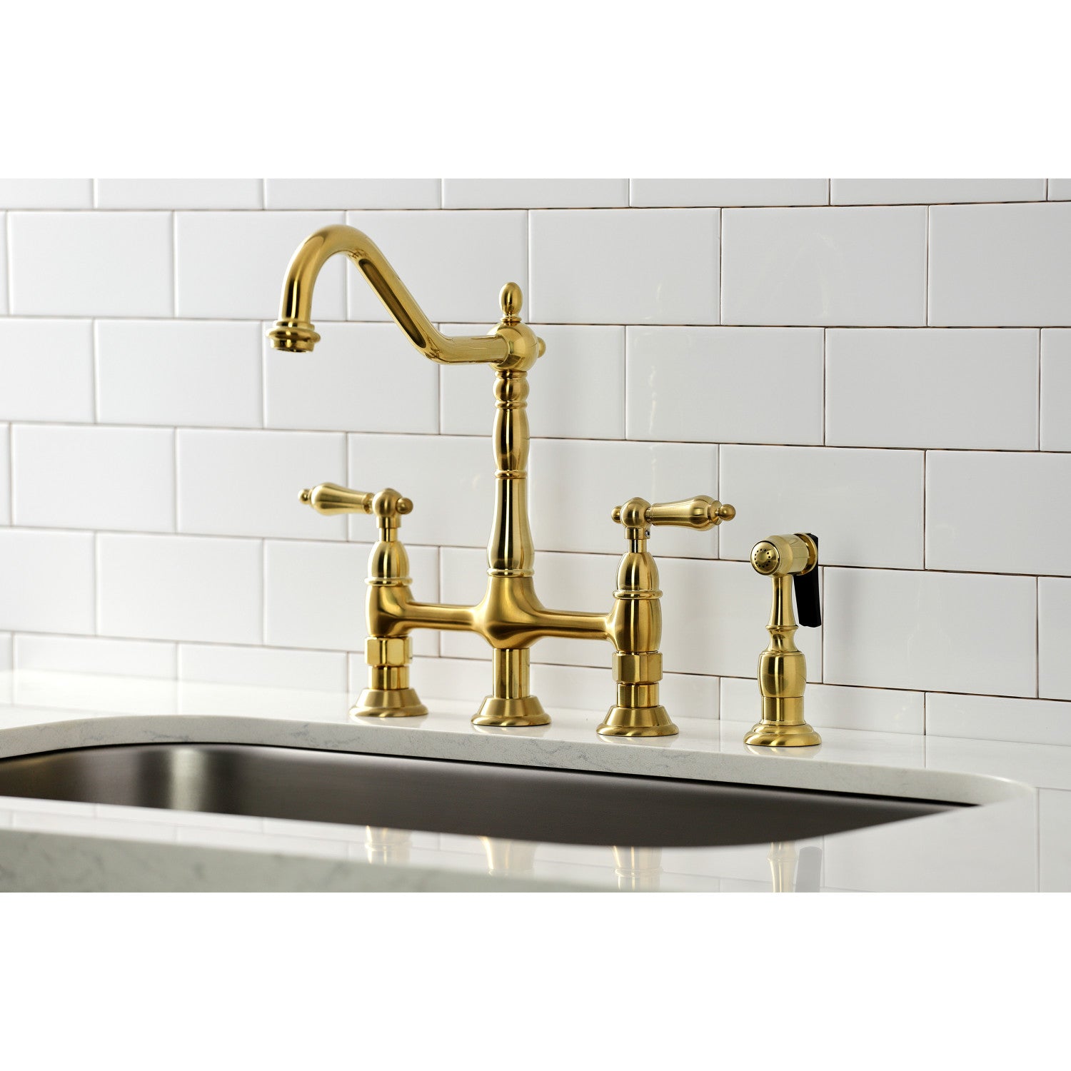 Kingston Brass KS1277ALBS brushed brass kitchen faucet with white tiled wall in the background