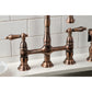 Kingston Brass KS127ALBSAC antique copper bridge faucet set on a white countertop with a tiled wall background