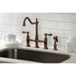 Kingston Brass KS127ALBSAC antique copper kitchen faucet with side spray installed in a white quartz countertop