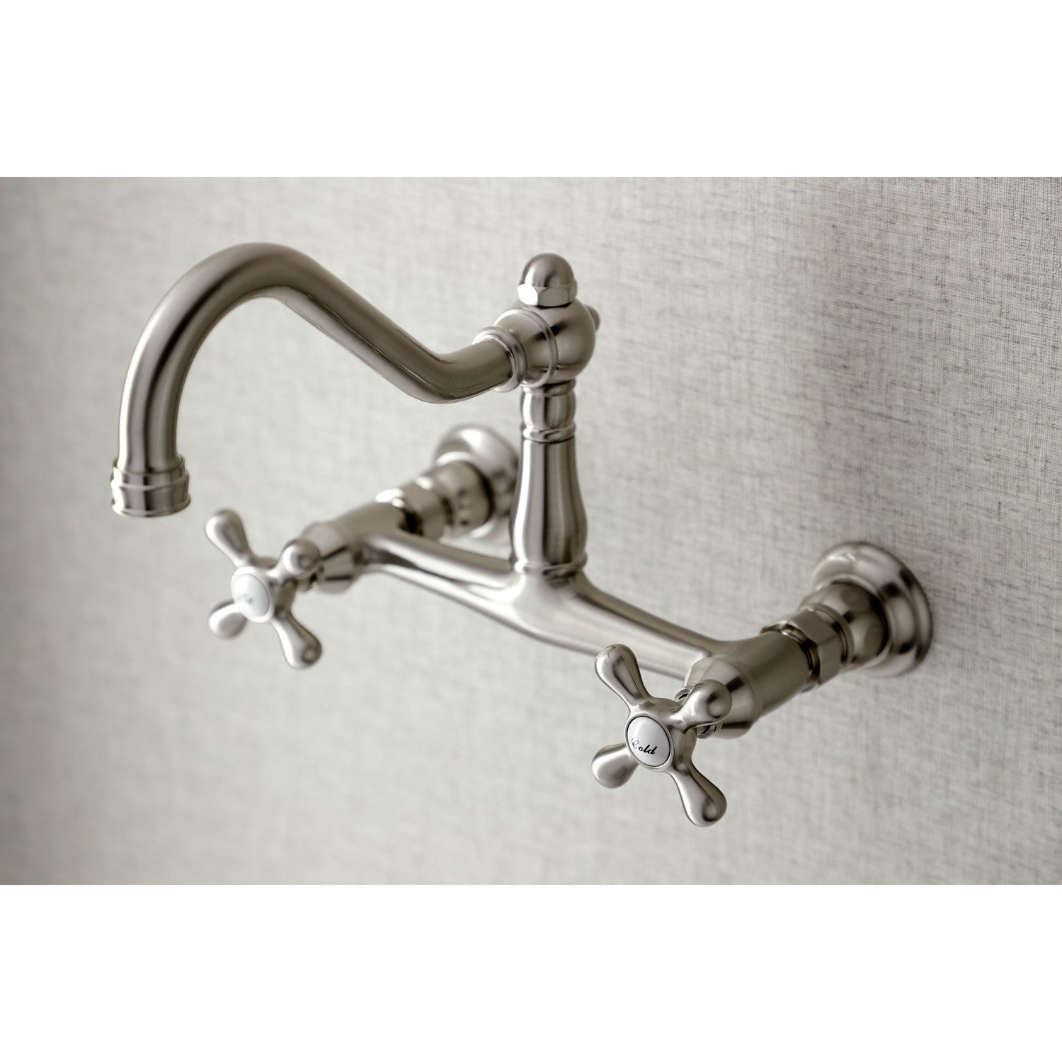 Kingston Brass KS3248AX brushed nickel  bathroom bridge faucet mounted on a gray wall