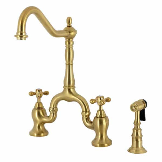 Kingston Brass English Country Deck Mount Bridge Kitchen Faucet showing brushed brass finish with vintage design and side sprayer.