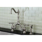 Kingston KS7758ALBS English Country Bridge Kitchen Faucet with Brass Sprayer, Brushed Nickel against a glass subway tile backsplash