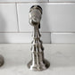 Kingston Brass KS7758AXBS brushed nickel kitchen side spray faucet on a marble countertop with tiled wall background