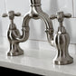 Kingston Brass KS7758AXBS brushed nickel faucet set on a white countertop with a tiled backsplash.