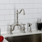 Kingston Brass KS7758AXBS brushed nickel kitchen faucet set in a quartz countertop against a white tiled wall.