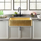 High res - Thompson Quiroga 33" Hammered Semi-Satin Brass Farmhouse Kitchen Sink - KSA-3322HPB installed in modern kitchen.