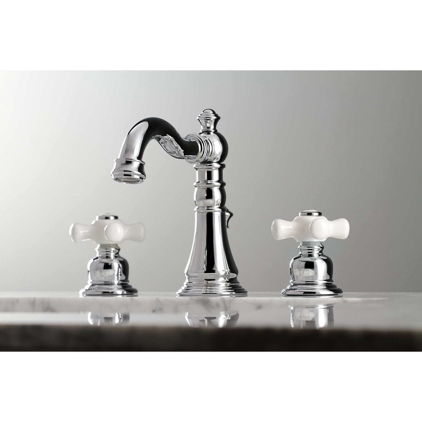 Close-up view of KINGSTON Brass American Classic Widespread Bathroom Faucet featuring Victorian design and elegant knobs.