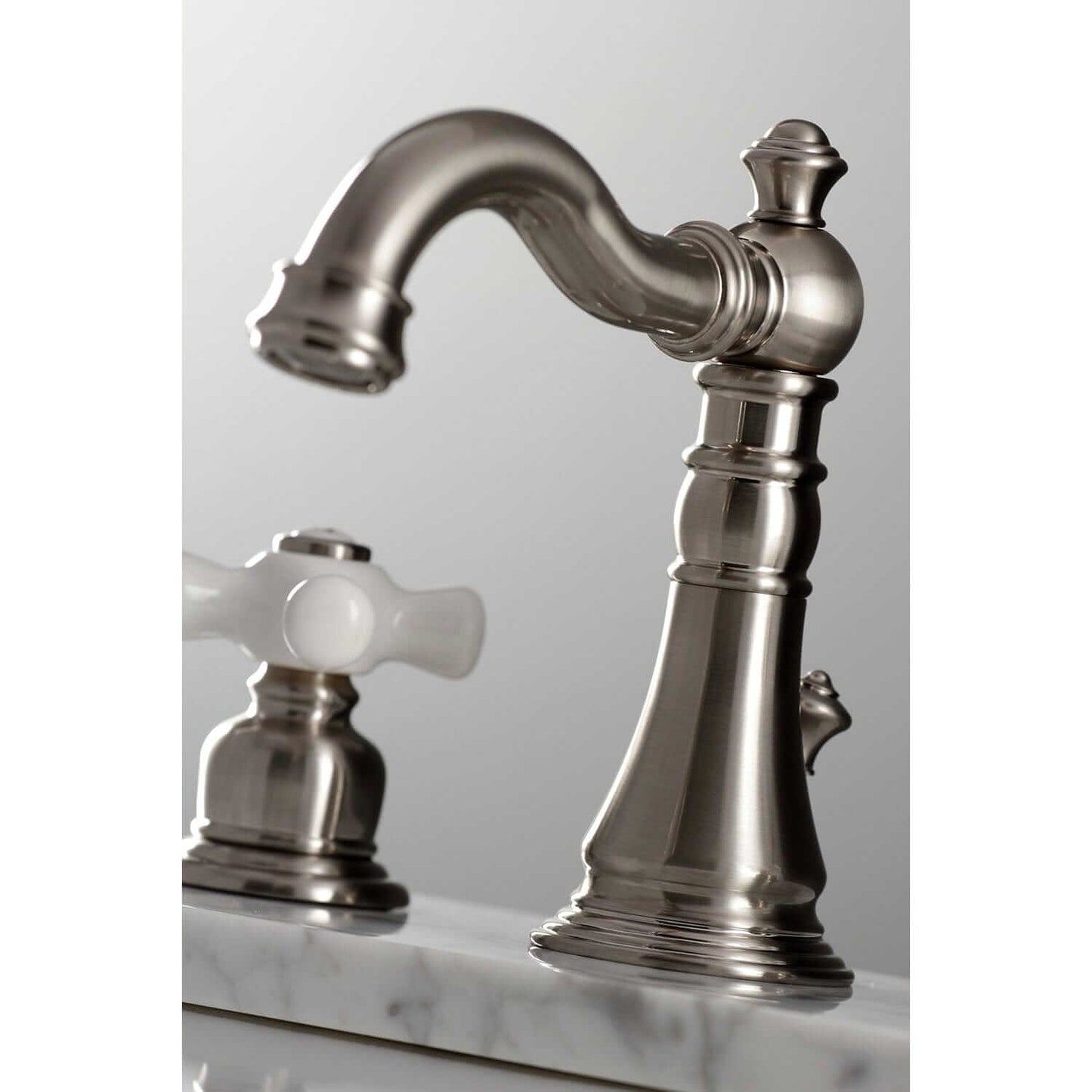 Detail view of KINGSTON Brass American Classic Widespread Bathroom Faucet showcasing elegant design and craftsmanship.