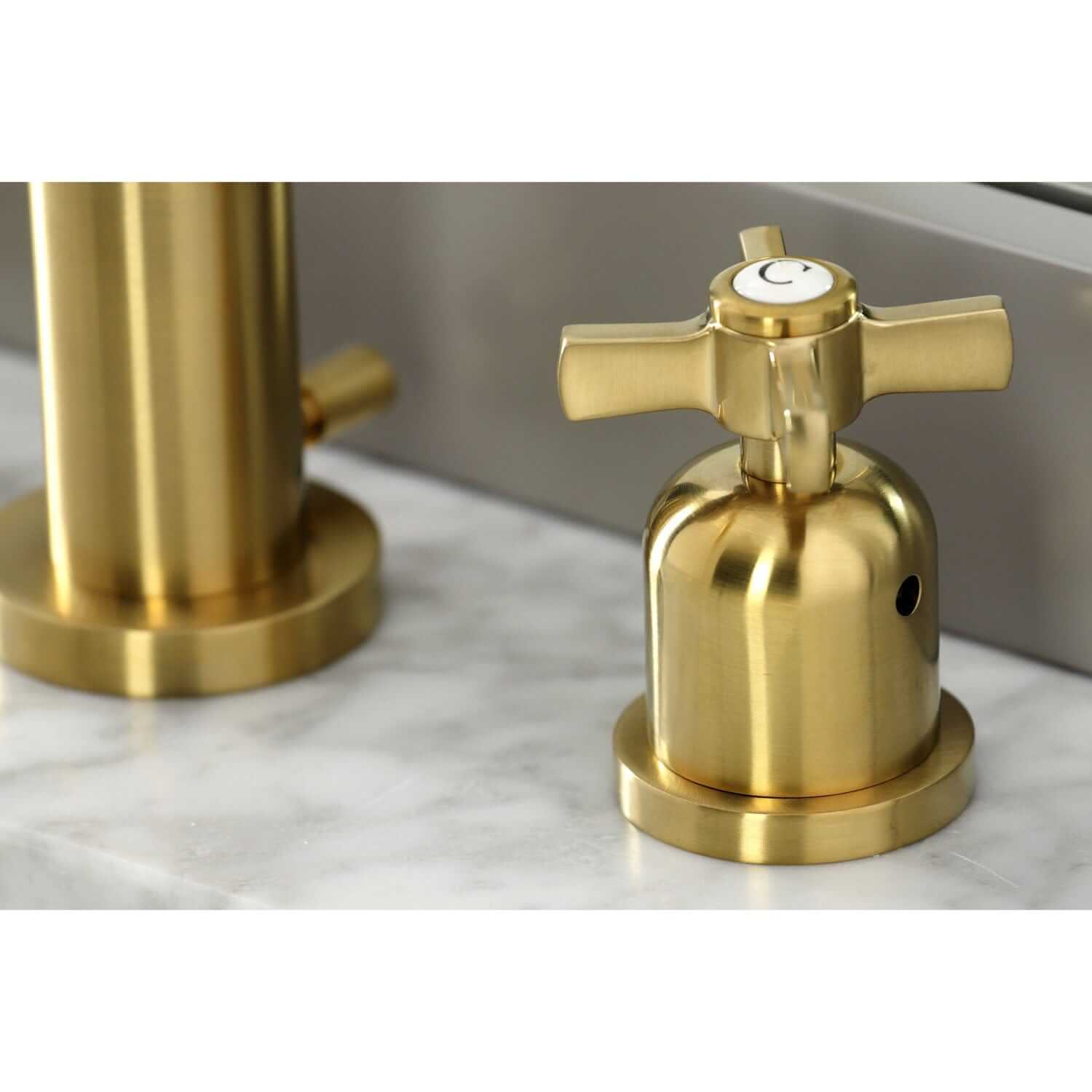 Faucet handle detail for Millennium widespread bathroom faucet in brushed brass