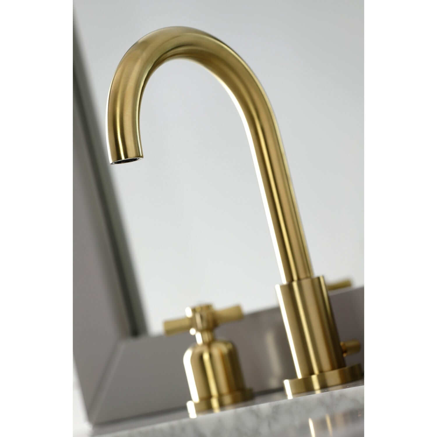 Spout detail for Millennium widespread bathroom faucet in brushed brass