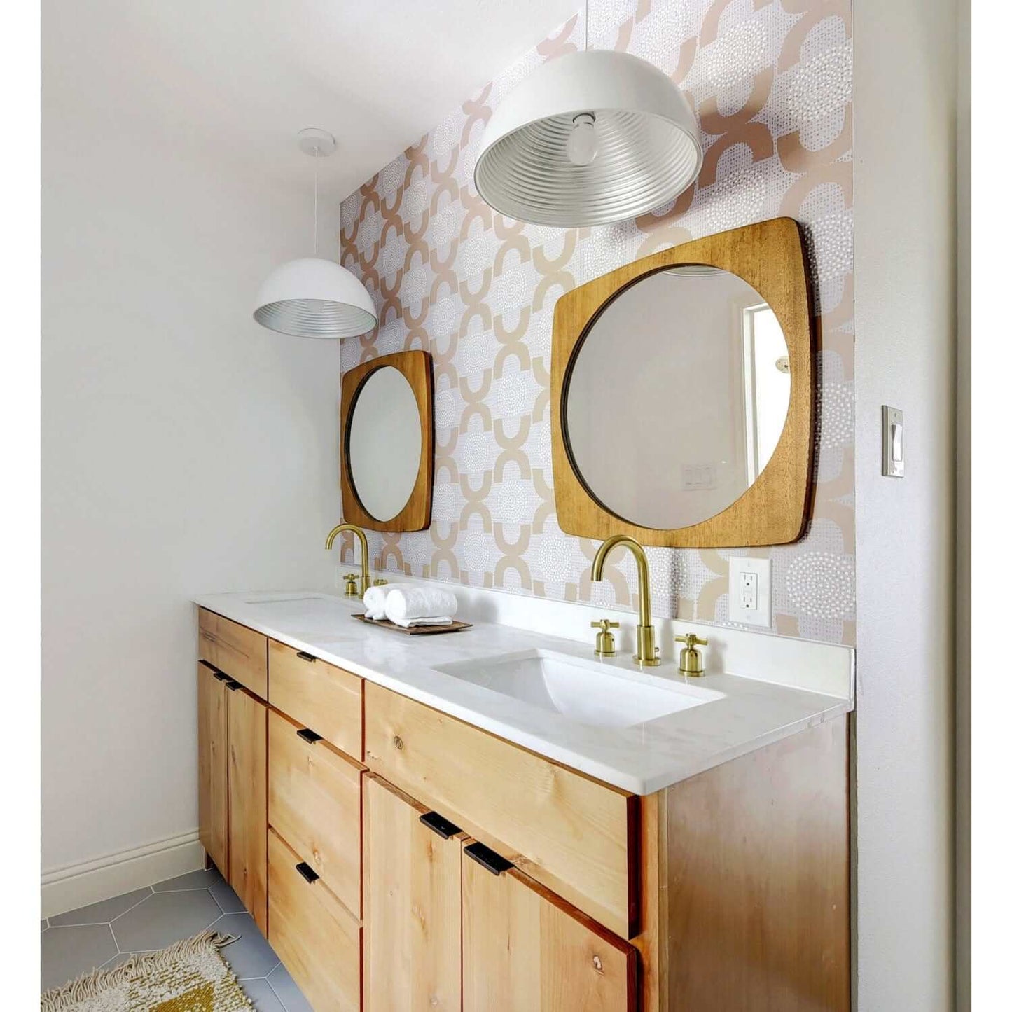 Bathroom remodel featuring Millennium widespread faucet in Brushed Brass