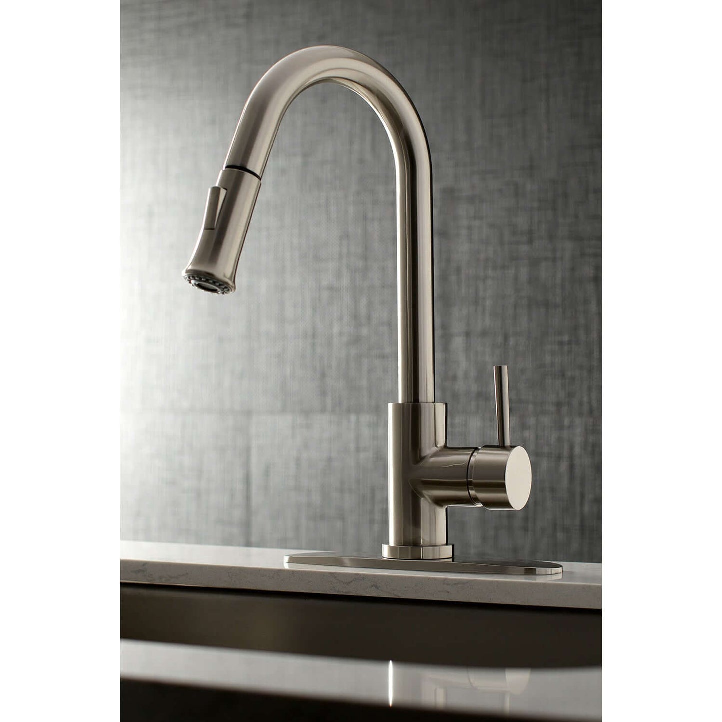 Kingston Brass LS8628DL single-handle brushed nickel kitchen faucet installed with deck plate in neutral kitchen