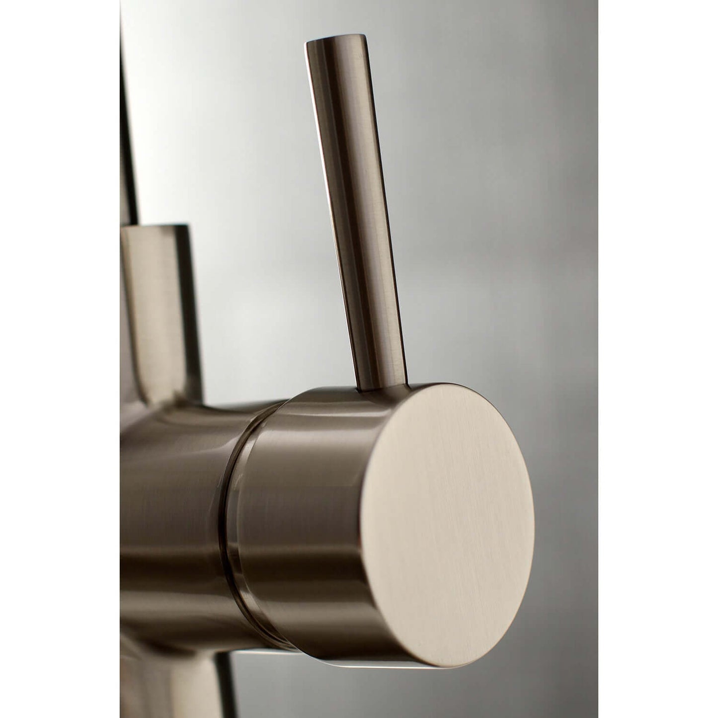 Close-up view of the handle of the Kingston Brass Single-Handle Pull-Down Kitchen Faucet - LS862XDL-P, showcasing modern design.