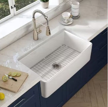 Latoscana 36" Reversible Fireclay Single Bowl Farmhouse Sink top view with apron front and kitchen faucet.