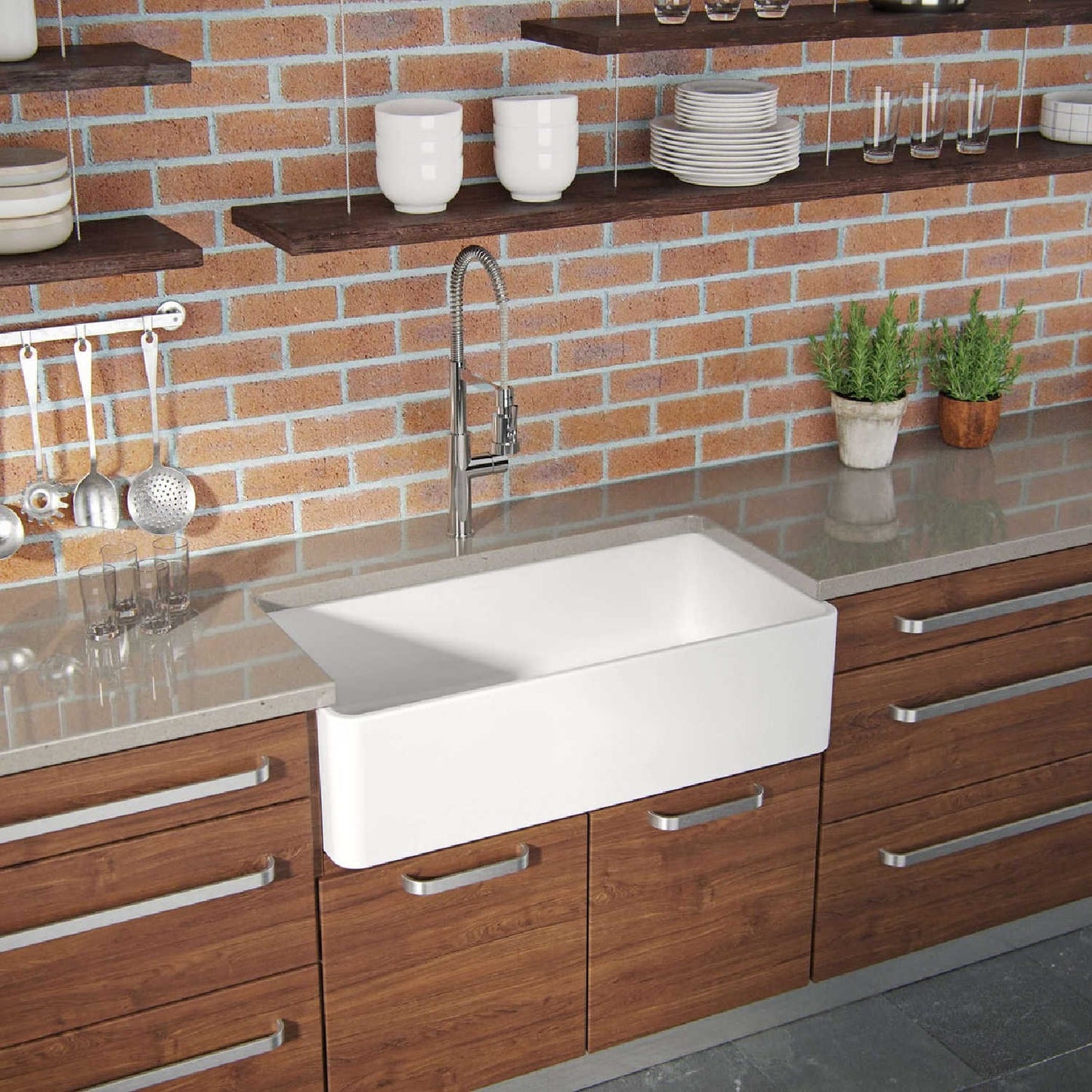 Latoscana 36" Reversible Fireclay Single Bowl Farmhouse Sink in a modern kitchen with brick wall and wooden cabinets.