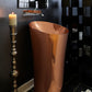 Thompson Tuxpan 1915 rose gold copper pedestal sink in a bathroom