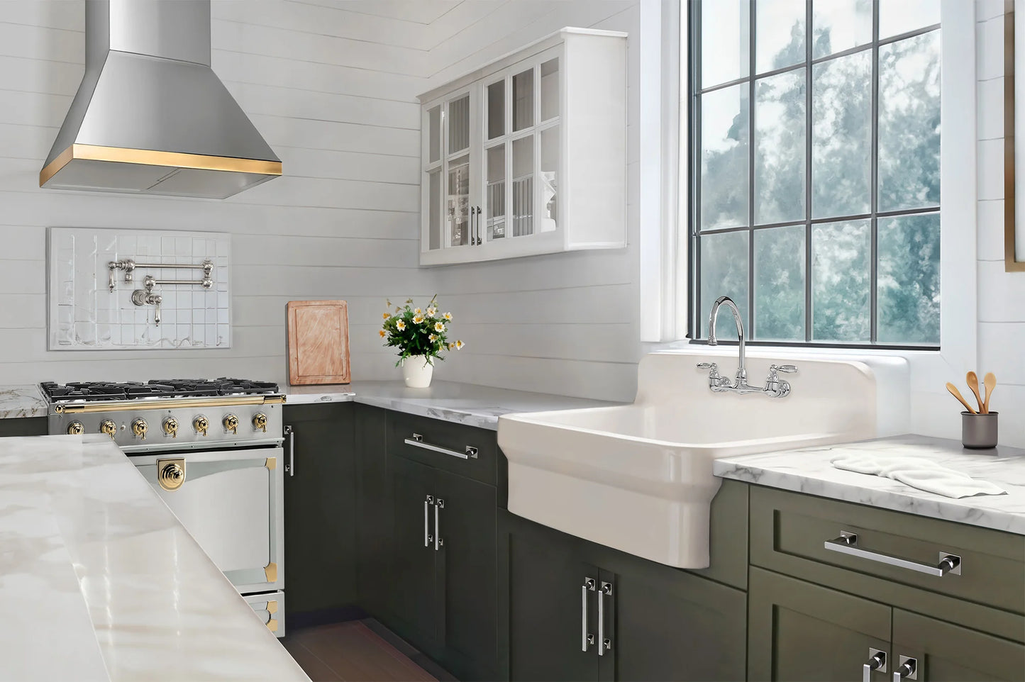 Modern kitchen with stainless steel appliances and white cabinets.