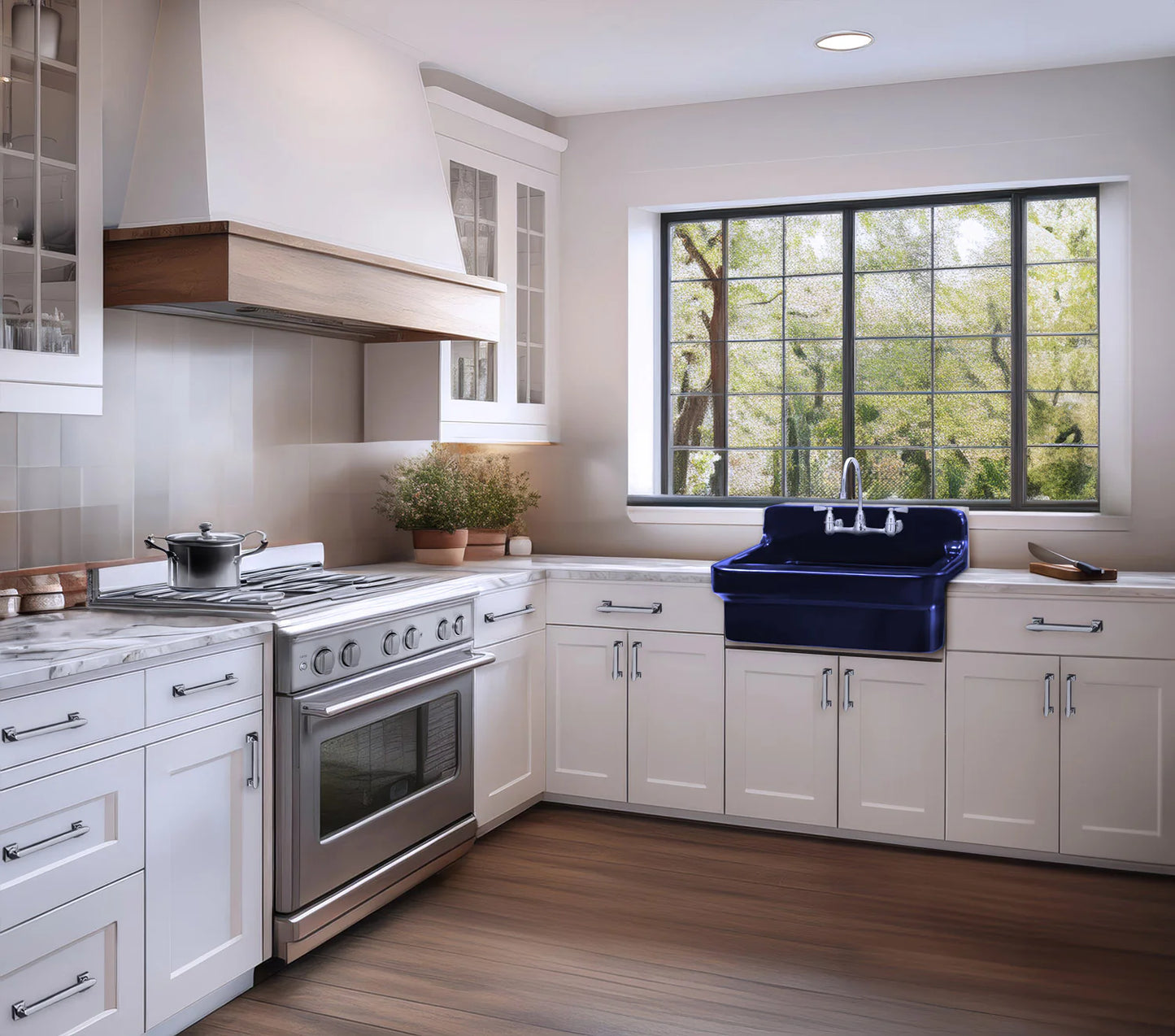 Modern kitchen with white cabinets, stainless steel appliances, and a blue sink.