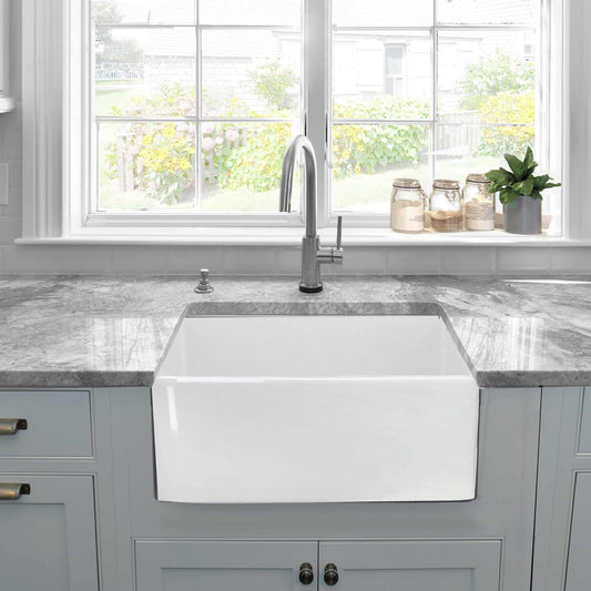 Nantucket Sinks 23.25" Fireclay Farmhouse Kitchen Sink - P-FCS23 displayed in a modern kitchen with a window view.
