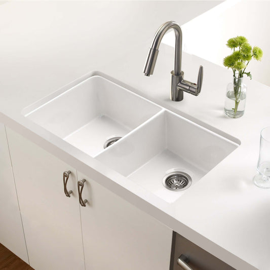 HOUZER PLATUS 32" Fireclay Undermount 50/50 Double Bowl Kitchen Sink with modern faucet in a stylish kitchen.