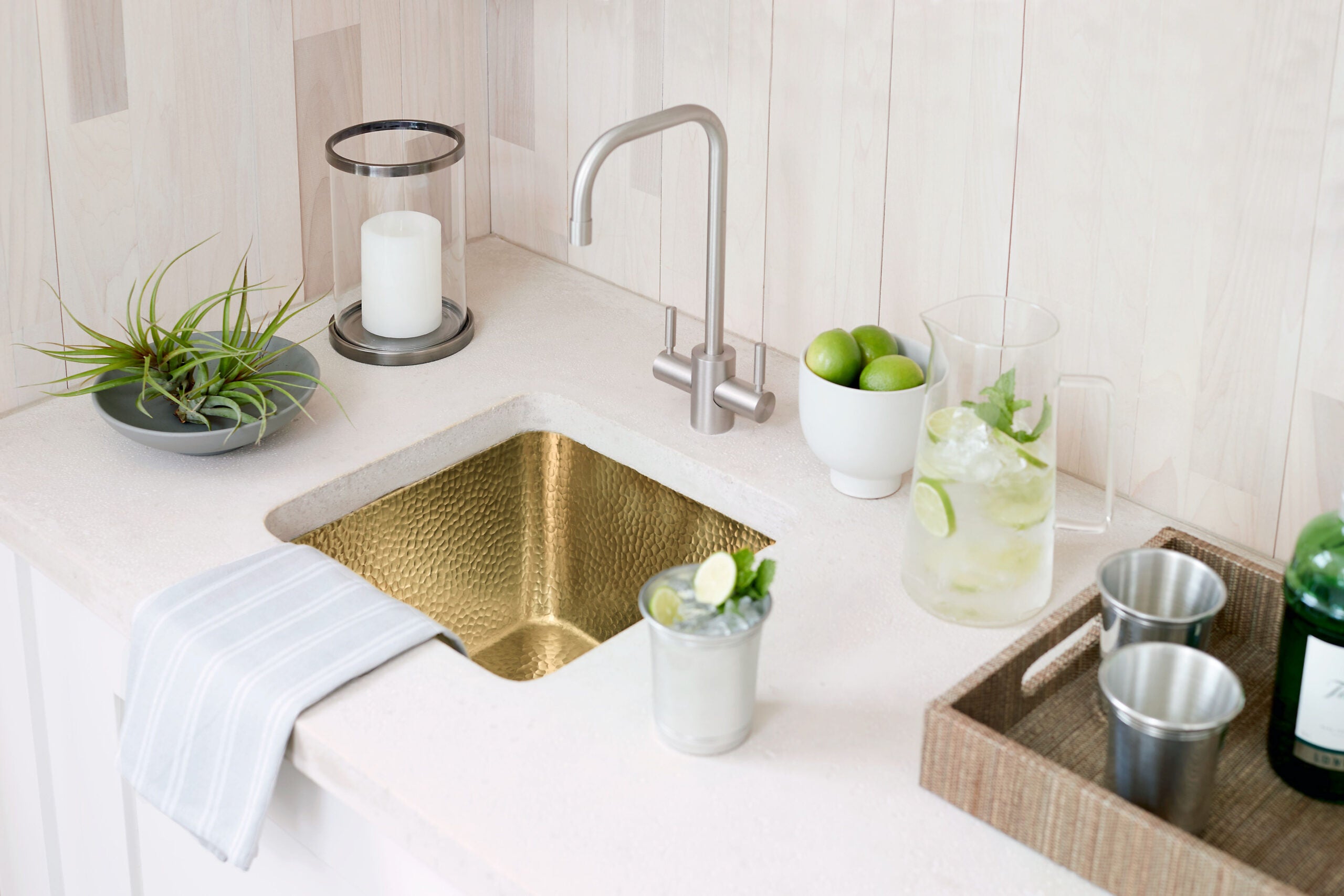 Lifestyle image of Thompson's Tamayo hand hammered, square bar sink.