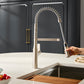 Ruvati RVF1233 Bianca Single-Handle Tall High-Arc Commercial Kitchen Faucet with Pre-Rinse Sprayer in a modern kitchen.