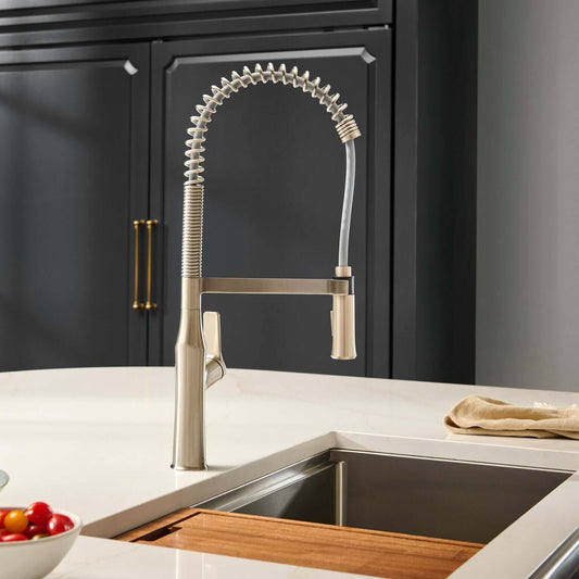 Ruvati RVF1233 Bianca Single-Handle Tall High-Arc Commercial Kitchen Faucet with Pre-Rinse Sprayer in kitchen.