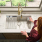 Ruvati RVF1233 Bianca Single-Handle Tall High-Arc Commercial Kitchen Faucet with Pre-Rinse Sprayer in a modern kitchen setting.