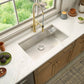 Ruvati RVF1233 Bianca Single-Handle Tall High-Arc Commercial Kitchen Faucet with Pre-Rinse Sprayer in kitchen sink setup.