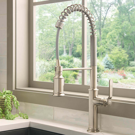 Ruvati RVF1238 Seneca Single-Handle Pre-Rinse High-Arc Kitchen Faucet in Stainless Steel installed in a modern kitchen.