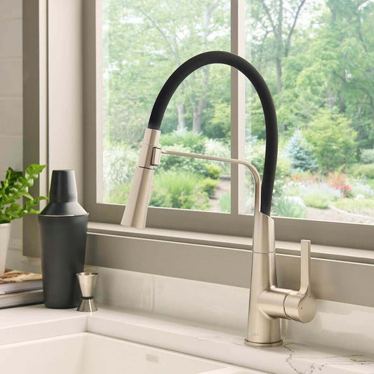 Ruvati RVF1242 Carina Single-Handle Flexible Hose Kitchen Faucet in Stainless and Black installed in a modern kitchen.
