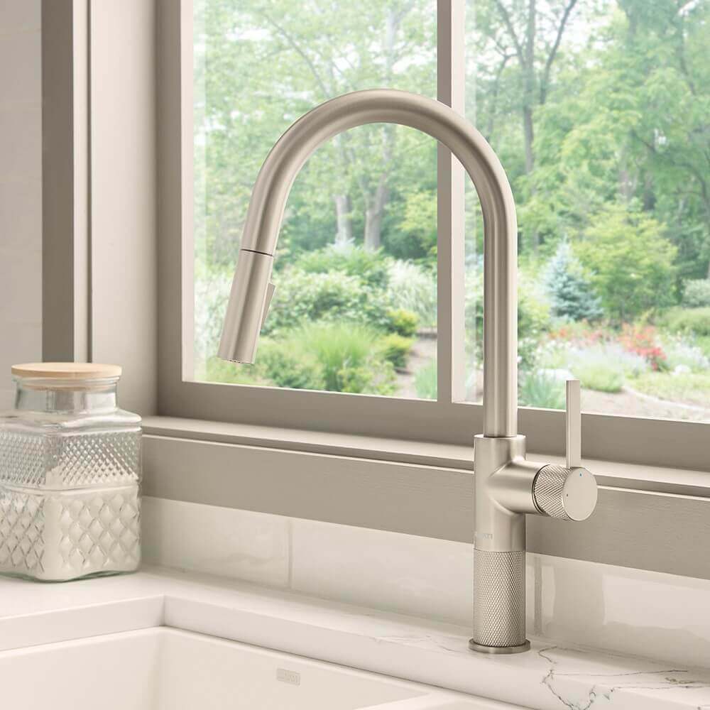 Ruvati RVF1248 Isola Single-Handle Pull-Out Kitchen Faucet with Knurl Detail in a modern kitchen setting.