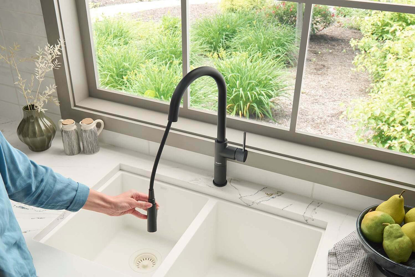 Ruvati RVF1248 Isola Single-Handle Pull-Out Kitchen Faucet with Knurl Detail in Matte Black finish, shown in kitchen.
