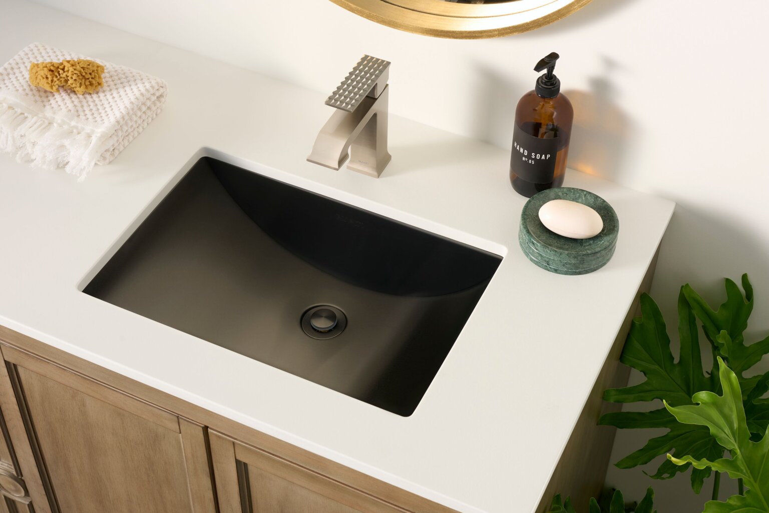 Ruvati RVF5132 Decora Single-Handle Square Bathroom Faucet in Brushed Nickel above stylish black sink.