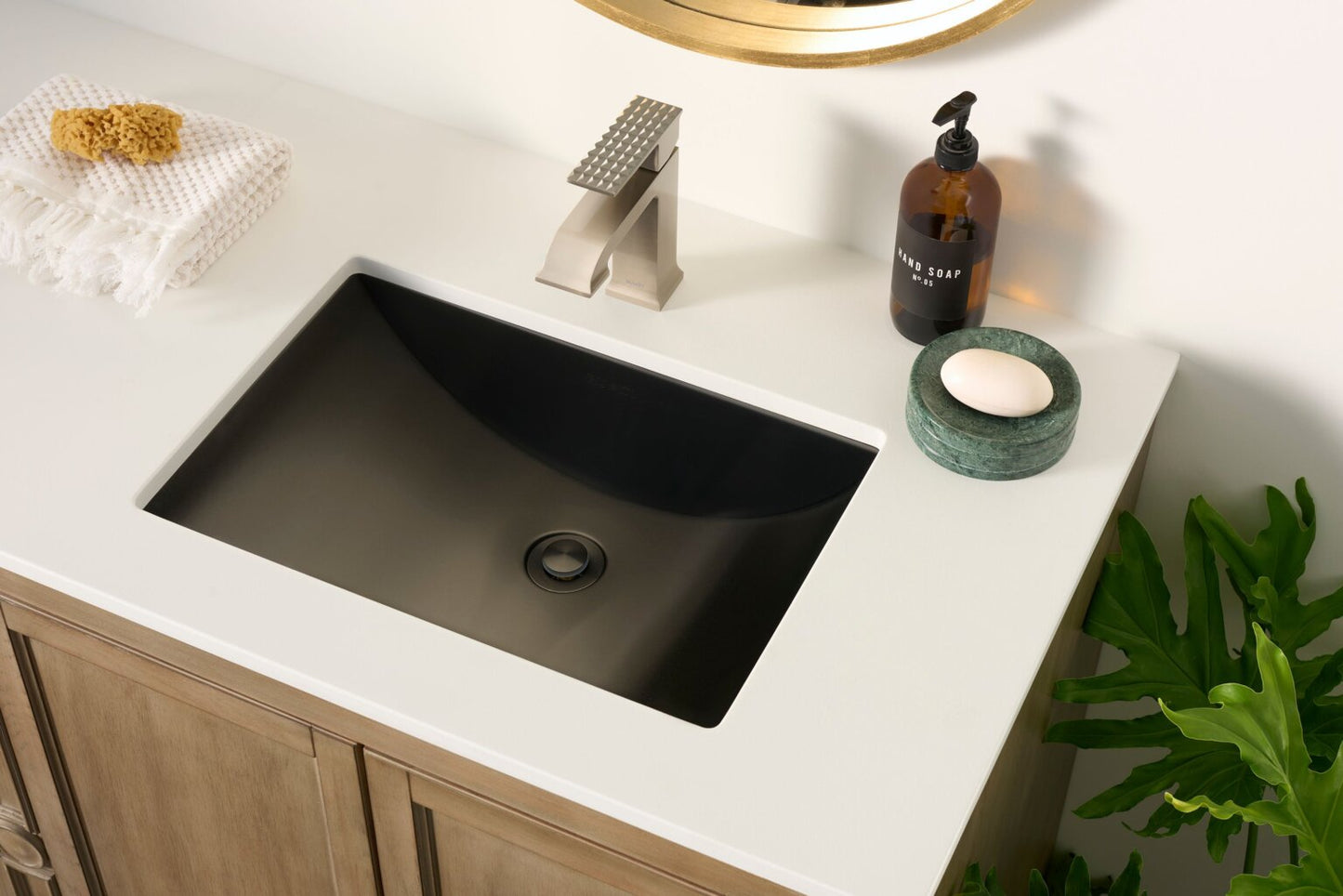 Ruvati RVF5132 Decora Single-Handle Square Bathroom Faucet in Brushed Nickel above stylish black sink.