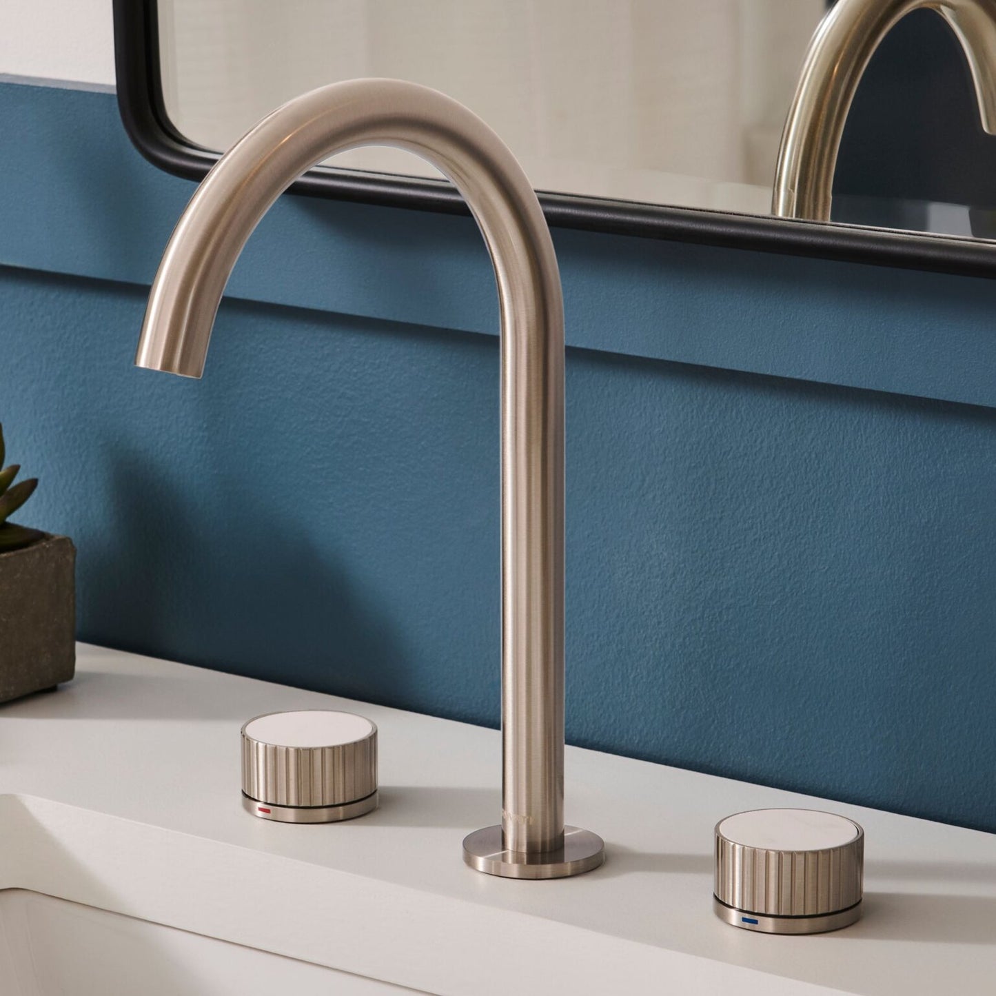Ruvati RVF5232 Athena Two-Handle Widespread Bathroom Faucet with Stone Detail in Brushed Nickel finish.