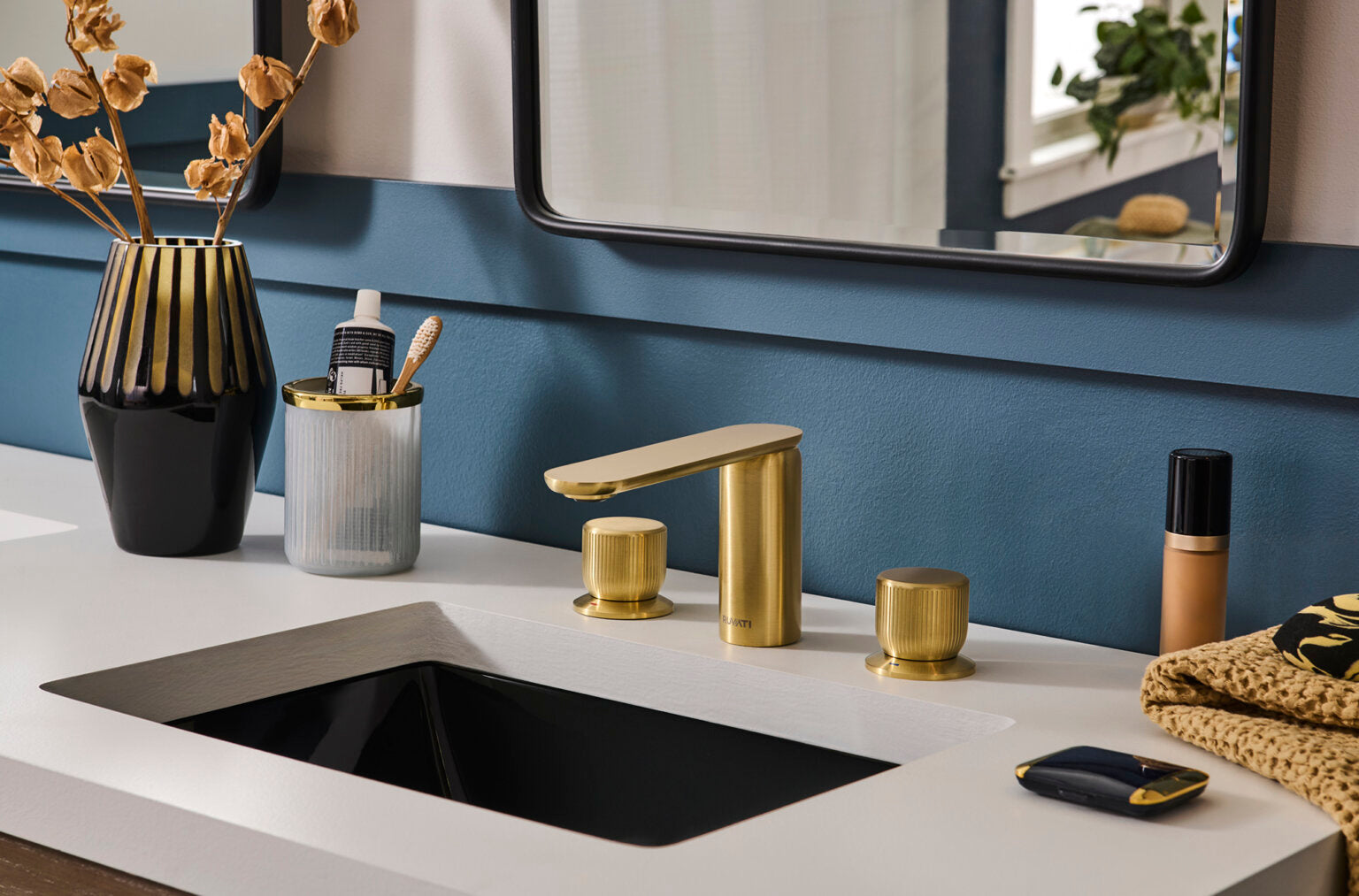 Ruvati RVF5235 Fabio Two-Handle Widespread Bathroom Faucet in Brushed Gold displayed on modern bathroom sink.