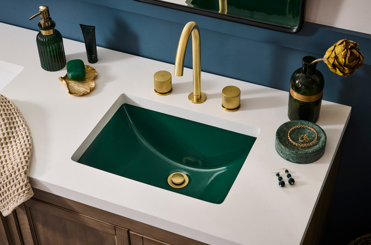Ruvati RVF5238 Fabio Two-Handle Widespread Bathroom Faucet with Textured Knobs in Brushed Gold on a stylish sink.