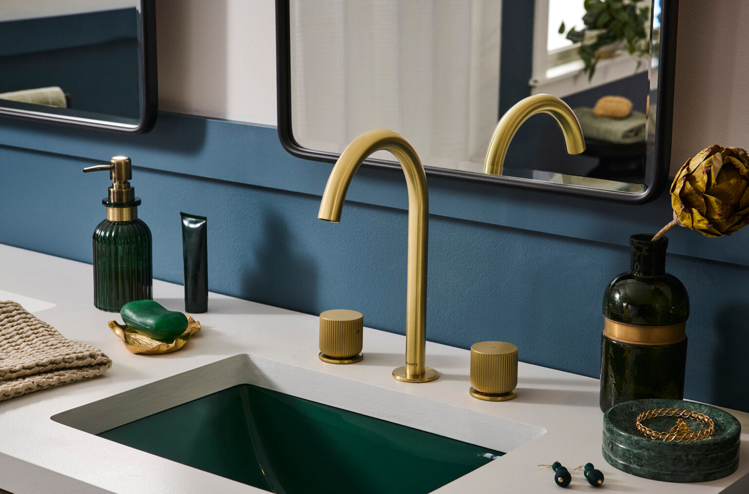 Ruvati RVF5238 Fabio Two-Handle Widespread Bathroom Faucet with Textured Knobs in Brushed Gold installed in modern bathroom.