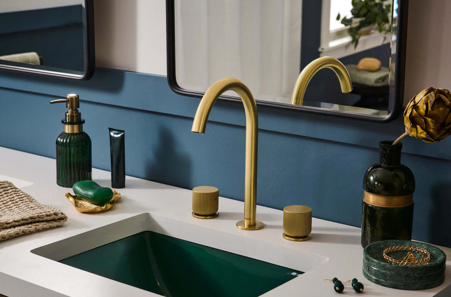 Ruvati RVF5238 Fabio Two-Handle Widespread Bathroom Faucet with Textured Knobs in Brushed Gold installed in modern bathroom.