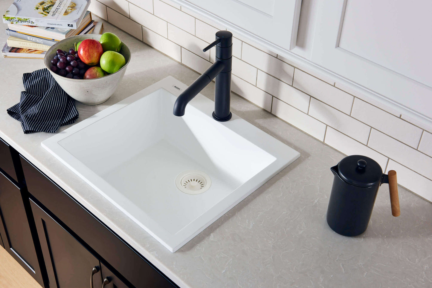 Ruvati epiGranite RVG1022 22" Topmount Single Bowl Wet Bar and Prep Sink with modern faucet and fresh fruits.