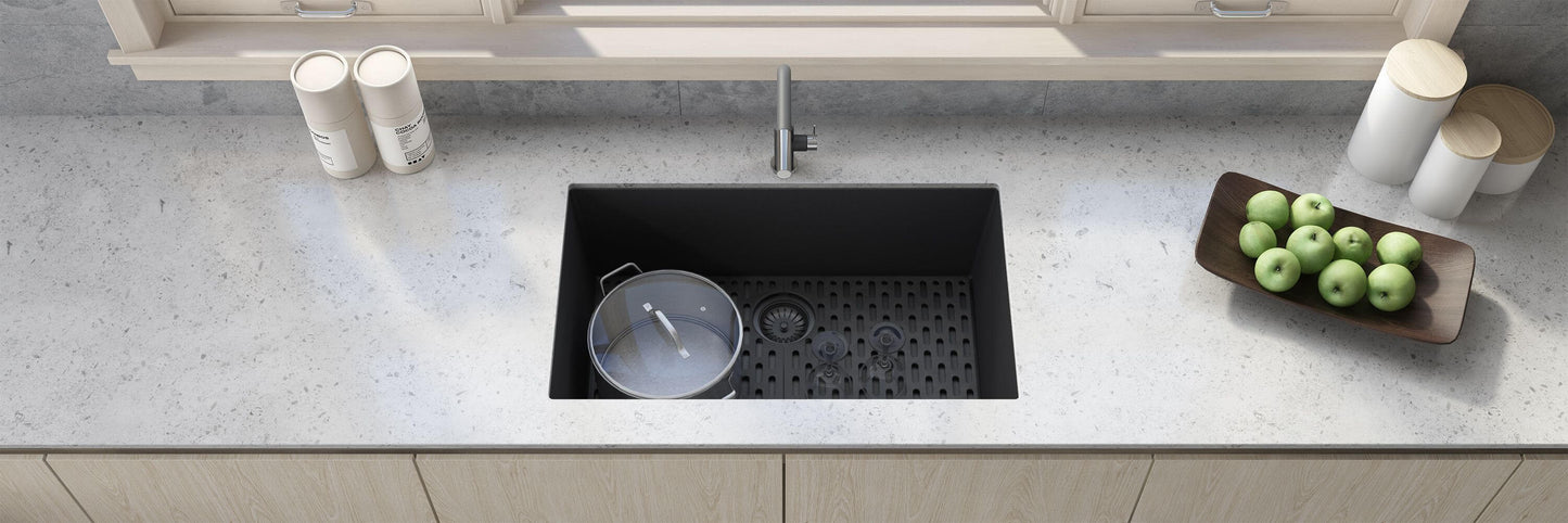 Ruvati RVG2030 30" Granite Composite Undermount Single Bowl Kitchen Sink on a countertop with modern decor and kitchen essentials.