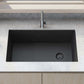 Ruvati 32" epiGranite undermount kitchen sink in Midnight Black, stylishly placed in modern kitchen countertop.