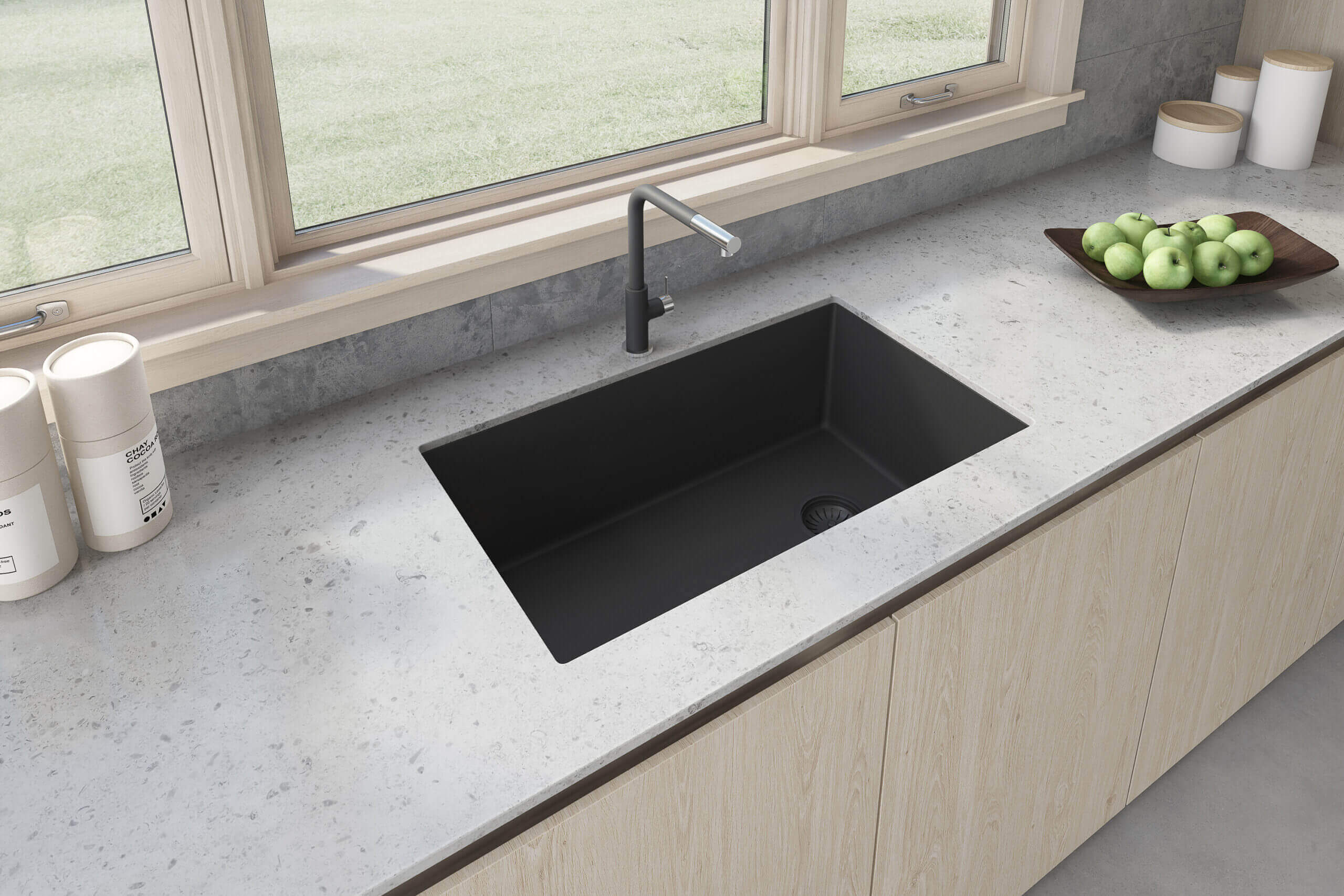 Ruvati 32 inch epiGranite undermount kitchen sink in Midnight Black installed in modern kitchen with grey countertop and wood cabinetry.