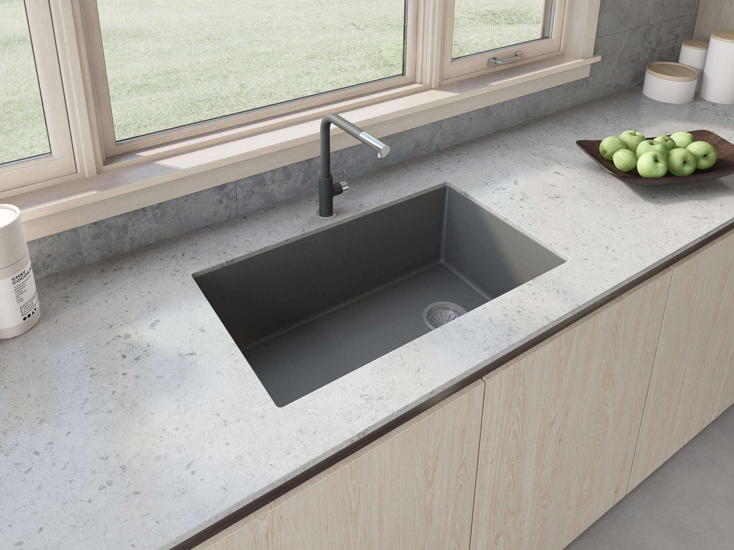 Ruvati 32 inch epiGranite undermount kitchen sink in Urban Gray with modern faucet and wooden cabinetry, showcasing a stylish kitchen setup.