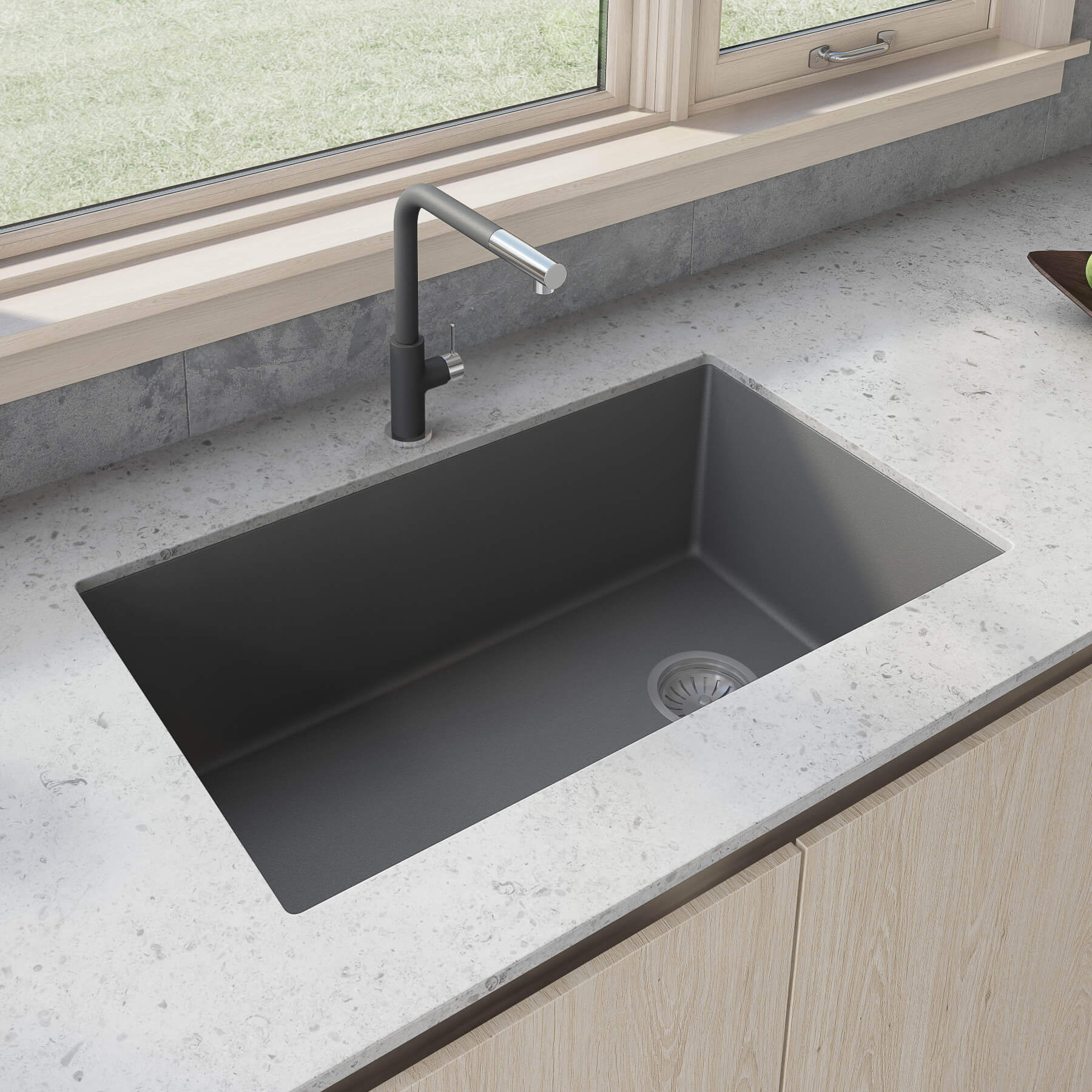 Ruvati 32-inch epiGranite undermount kitchen sink in Urban Gray composite with faucet on a stone countertop.